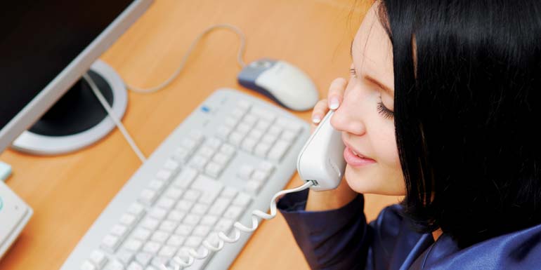 Young beautiful woman speaking by phone