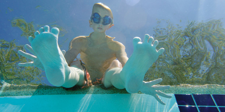 Boy at the swimming pool