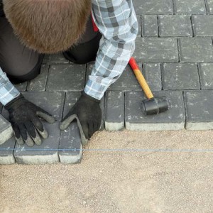 Paver laying driveway pavement out of concrete pavement blocks