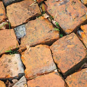 Red brick road macro fragment photo background texture