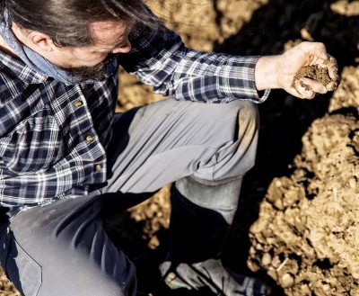 Close up from a Smallholder with soil in his Hand