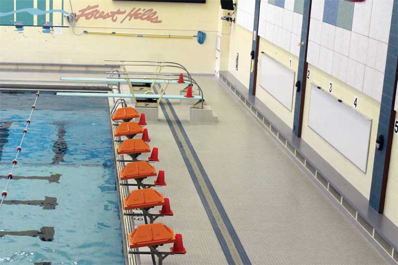 A bench in the natatorium has perforated metal openings to help with indoor air quality