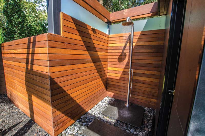 A private outdoor shower is attached to the cabana/bar.