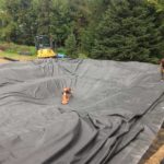 The liner installation is a heavy job that can require several team members.