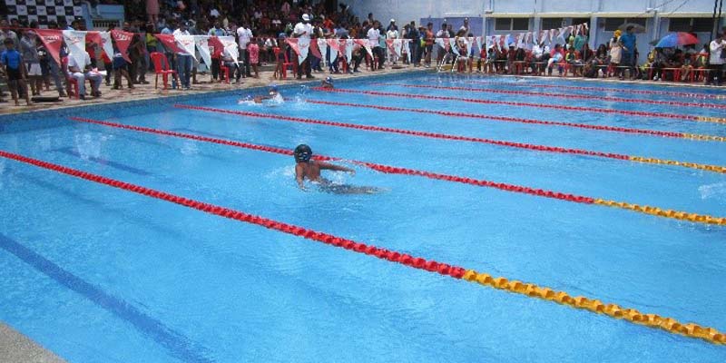 Child swimming in pool as part of a learn to swim program