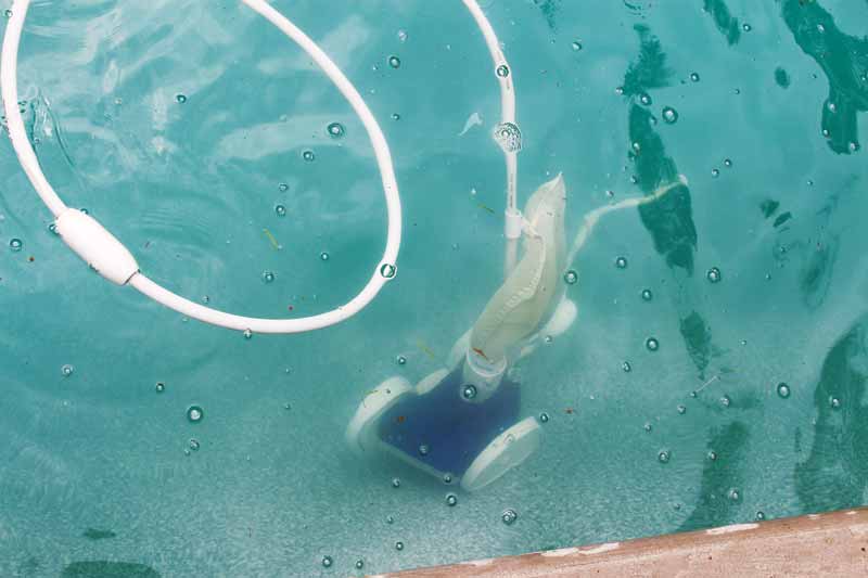 Pressure-side cleaners work by connecting a hose from the cleaner head to the pool return.