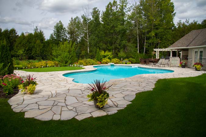 The jig-saw puzzle appearance of a random flagstone (limestone) patio. Random flagstone material costs are the lowest of all natural stone pavers, although installation labour costs can be the highest.