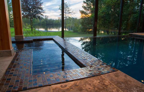 A sleek, perimeter-overflow hot tub was positioned to one side of the pool to take advantage of one of the property’s best vantage points.