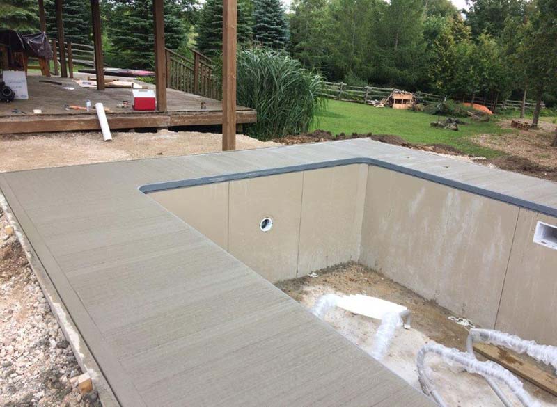 The location of the pool was designed around the large, pre-existing deck that was built off the home and into the hillside.