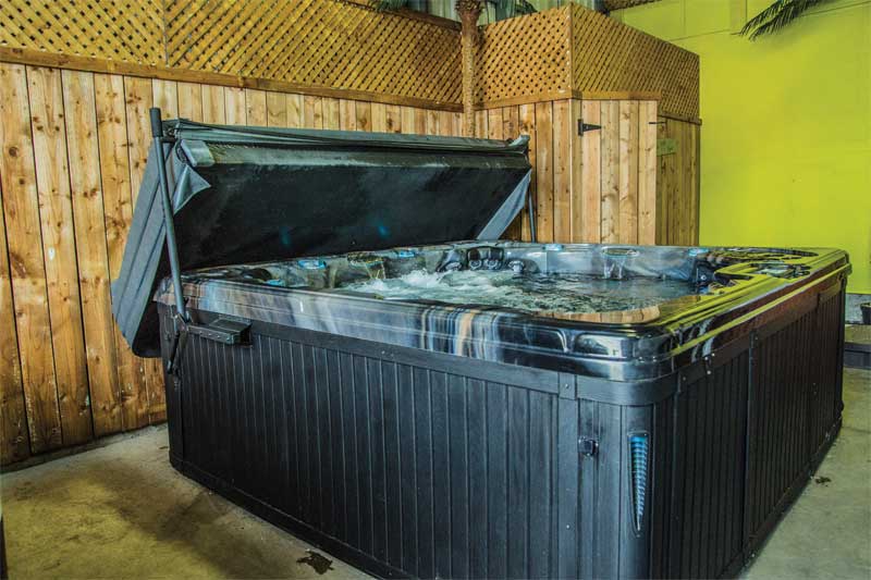 Displaying a hot tub with a cover and lifter as a full unit on the showroom floor can set the customer up for purchasing all three items together.