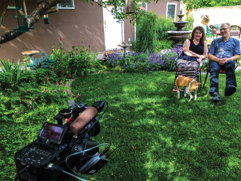 Customer testimonial videos can be filmed in an interview format with the client in their backyard.