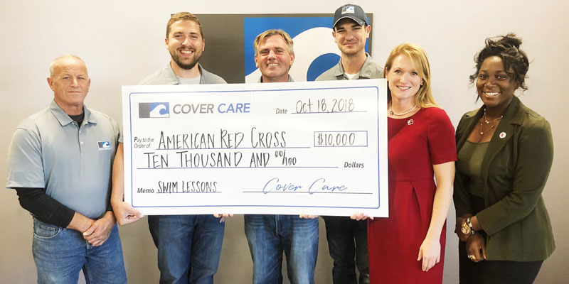 Cover Care’s Dean Mikels, Jared Pepmeier, Darren Cardwell, and Mitch Valdez present the company’s donation to Kate Hayward and Duchess Adjei of the American Red Cross.