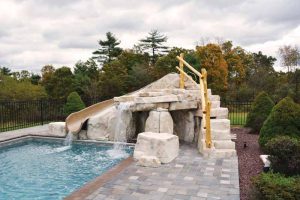 These nature-inspired elements can be built to incorporate fun accessories like slides, waterfalls, and jump rocks which are then blended with pavers and other hardscape decks.