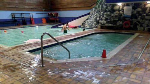 earl mah aquatic centre. The 18-m2 (194-sf) wide skimmer whirlpool, with a volume of 10,834 L (2862 gal), was located in the middle of the building. It was built of concrete and finished with tiles. The current pool technology room is located behind the back wall of the pool.