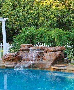 Have at least three layers that are tall, medium, and short to provide visual interest around the water feature.