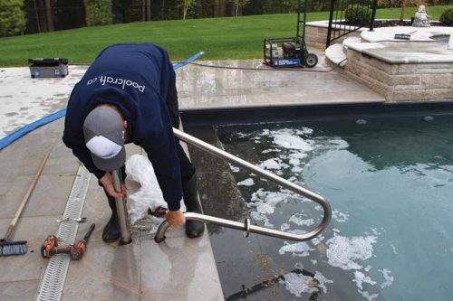 After treating the pool, the water level must be drained below the skimmer.