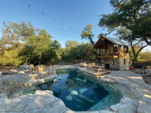 The tree house offers an interesting visual focal point—which could not have been achieved with a standard roof on a pool house—and transforms the backyard structure into an ideal retreat for the homeowner.