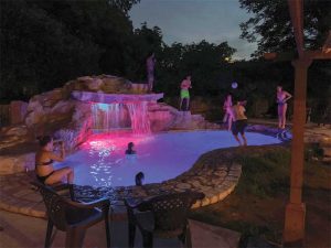 Strategic use of outdoor lighting can help focus on new water features and enhance the entertainment value of the backyard.