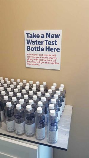 To eliminate crowding around the water station counter, retailers should provide a designated area where customers can drop off their water samples to be analyzed.