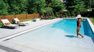 Resort-style, beach-entry fibreglass pools are options that help builders stand out from competitors.