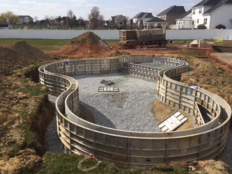 Once the forms, plumbing, and structural steel are in place, a special design mix of concrete is used to create a 254-mm (10-in.) thick wall.