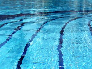 An Olympic-sized swimming pool with racing lanes.