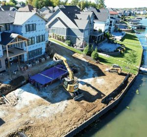 Since all the houses are located on the reservoir, high-water tables made it necessary to plumb and fill the pools with water to ensure they remain in-place securely.