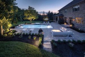 Landscape lighting dramatically enhances this space after dark. 