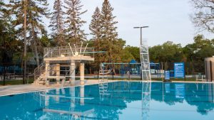 Lane pool, dive boards, and climbing wall at Wascana Pool.