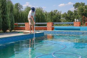 Using a vacuuming system with a fine mesh bag will help clear up the water, along with any algae buildup.