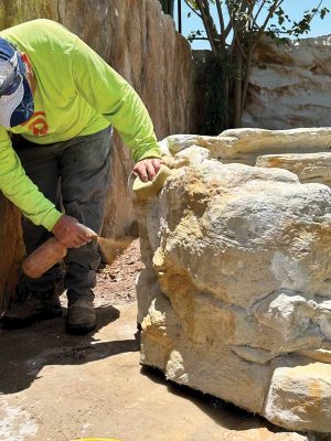 Testing small sections at the back of the water feature is always a good approach as hardscape designers master the art of staining concrete.