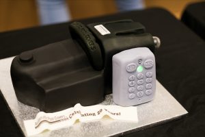 The celebration cake was shaped into Automatic Pool Covers Inc. cover-motor and PowerTouch Touchpad.