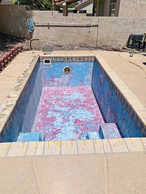 Preparing the pool before spray-application of the material.