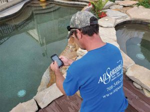 Field technicians using cutting-edge software to record water test results via specialized mobile apps, redefining modern business practices.