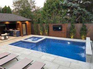 A feature privacy screen located behind the pool, complete with an outdoor TV, meant soccer matches and movies could still be enjoyed on the water.