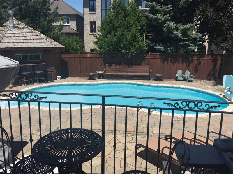 The homeowner's existing, older-style pool, typical of its era, occupied a substantial portion of the backyard.