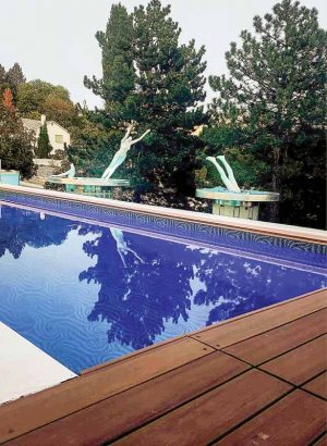 Old mannequins were fashioned into a triptych, depicting a diving woman amidst the serene waters and views of Lake Okanagan.