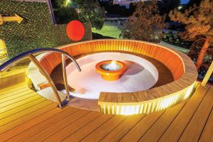 The living fractal: from the round sunken fire pit, through the art pedestals, to the round hot tub, the design embodies a captivating geometric harmony.