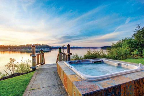 A spa/hot tub by the lakeside.