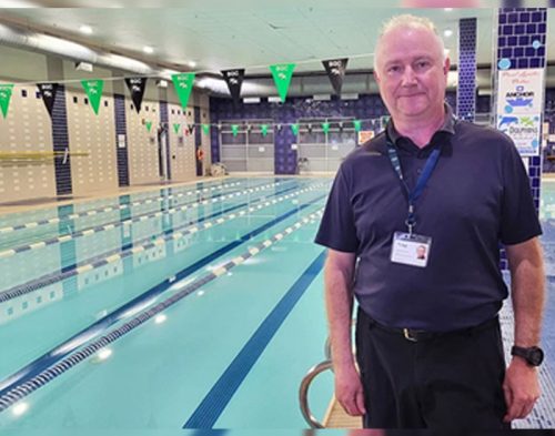 man standing near pool