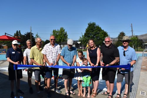 group of people at a ribbon cutting ceremony