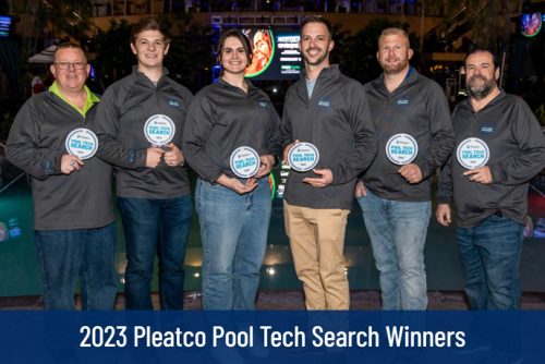 group of people standing with awards