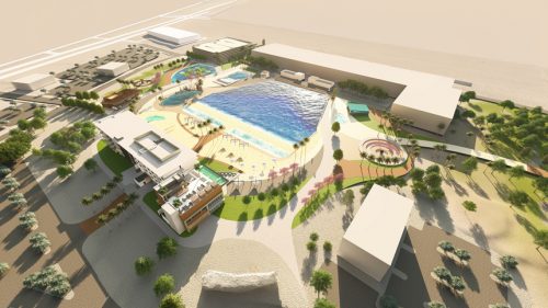 Rendered aerial view of a wave pool complex featuring a central surf pool, surrounding lounge areas with umbrellas, landscaped greenery, adjacent buildings, and recreational spaces, designed for a modern outdoor leisure experience.